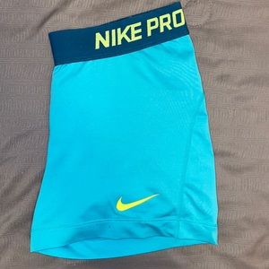 Juniors Nike Pro Dri-Fit Shorts. Blue with navy blue waist band.